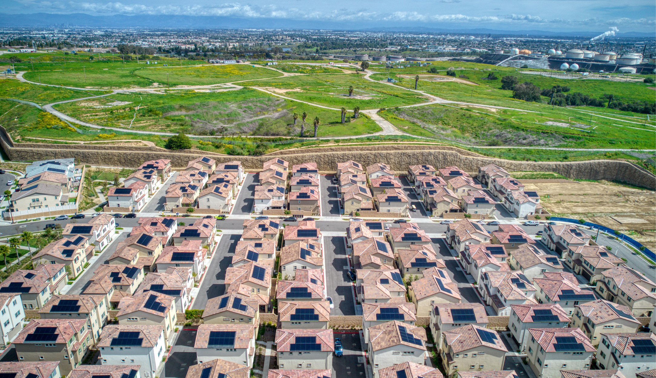 Image of houses and a green field